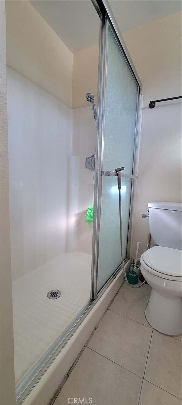 19221 Sherman Way, Unit 6 Reseda, CA 91335 - Photo 27 of 35 a bathroom with a toilet and a shower