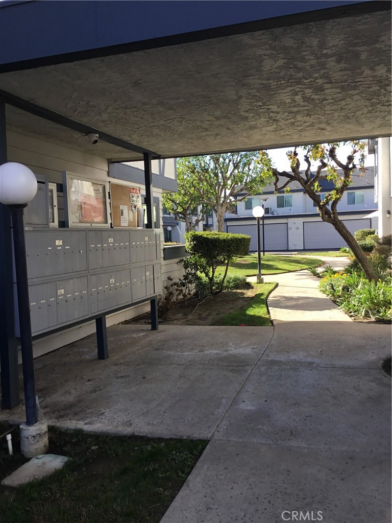 19221 Sherman Way, Unit 6 Reseda, CA 91335 - Photo 5 of 35 a view of a patio with table and chairs potted plants with wooden floor