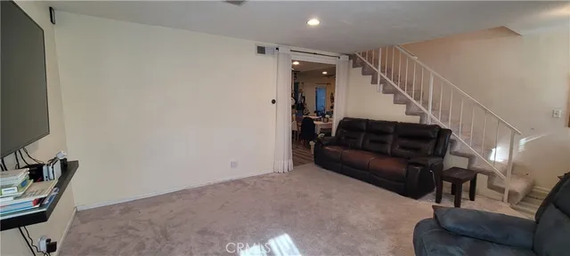 a kitchen with a stove a refrigerator and a sink