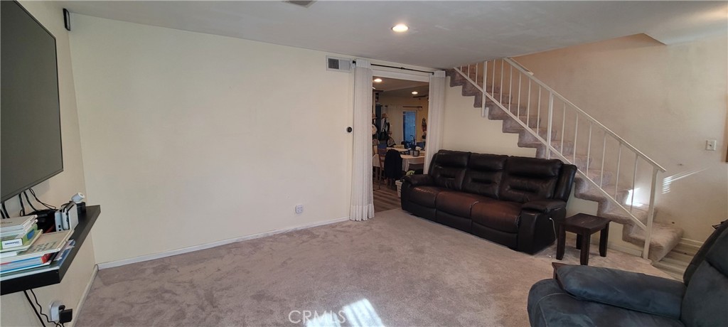 19221 Sherman Way, Unit 6 Reseda, CA 91335 - Photo 10 of 35 a living room with furniture and a potted plant