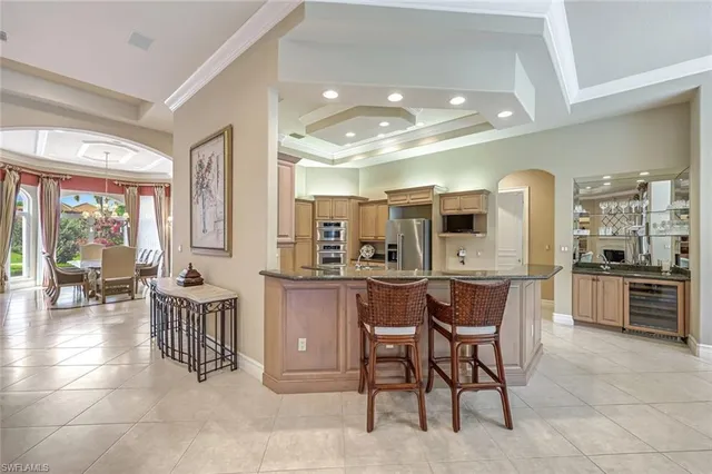 a kitchen with a table and chairs in it