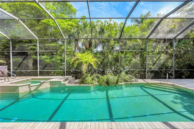 a view of a porch with chairs and backyard