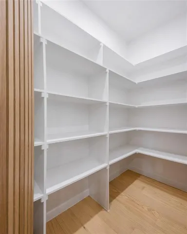 a view of an empty room with closet
