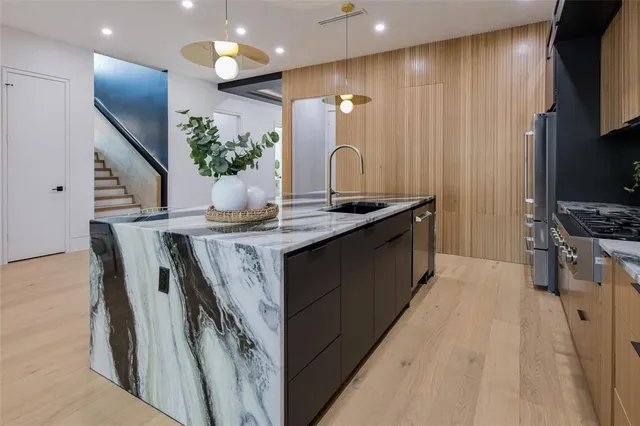 a kitchen with a dining table and chairs