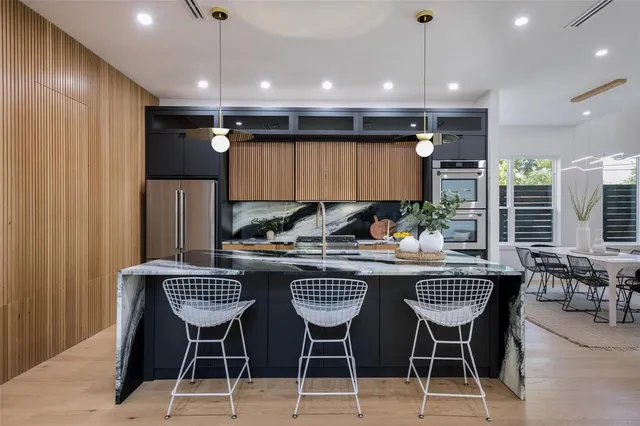 a kitchen with a refrigerator and cabinets