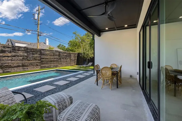 a view of swimming pool with seating area