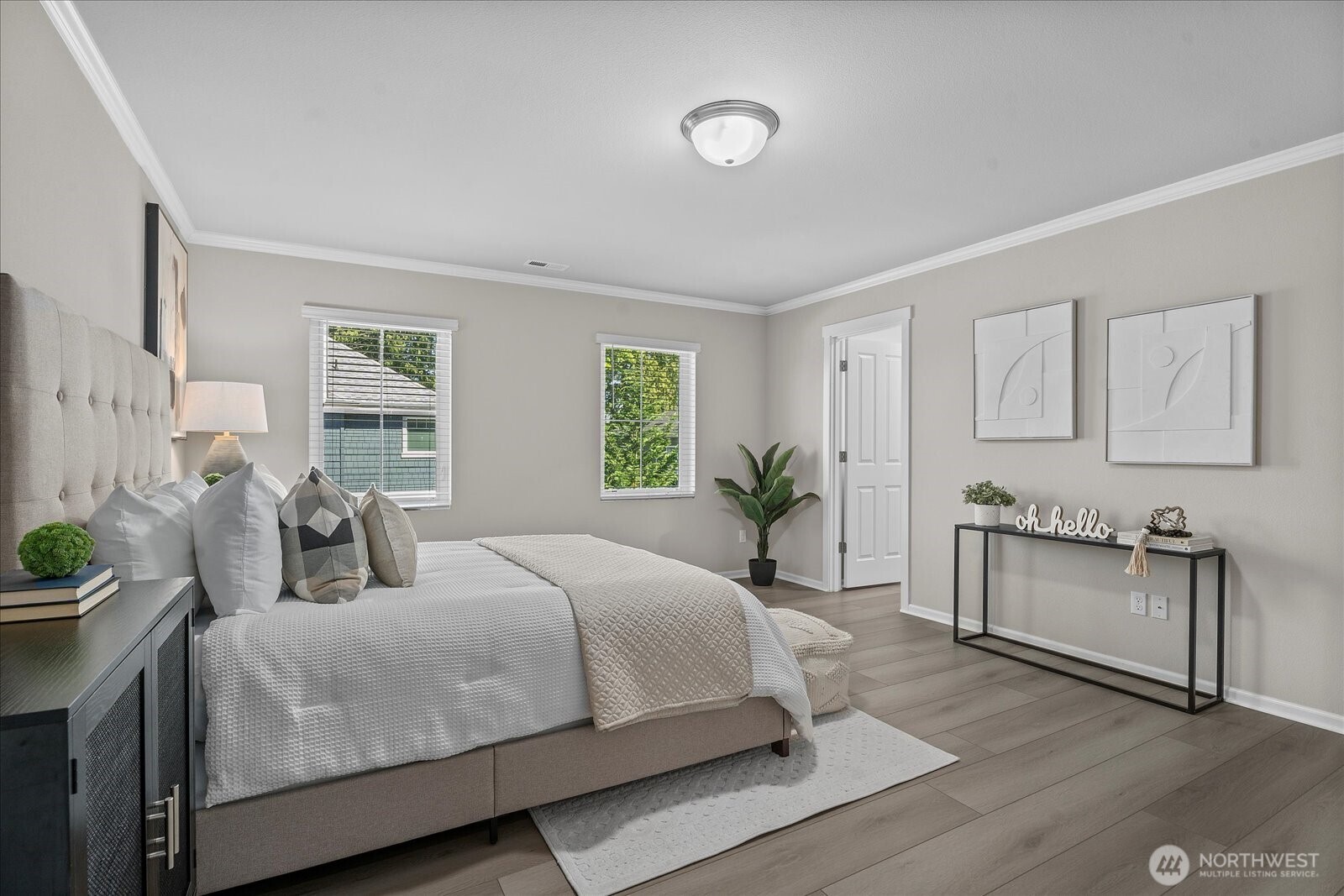 9901 13th Street Southeast Lake Stevens, WA 98258 - Photo 20 of 37 a bedroom with a large bed and paintings on the wall