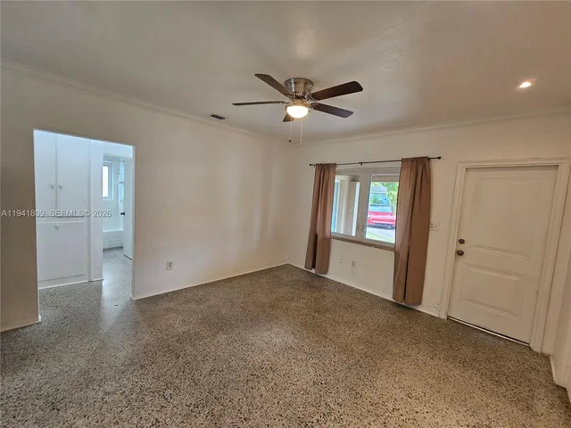 a view of an empty room with a window