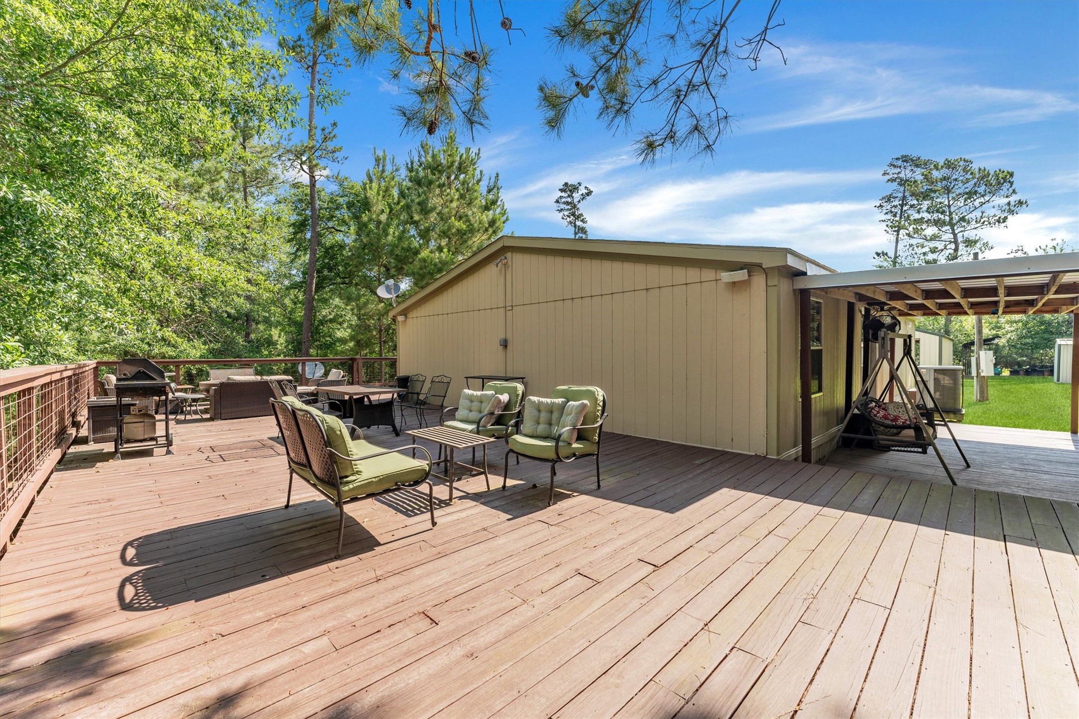 50 Fm 3179 Road Huntsville, TX 77320 - Photo 34 of 45 Spacious wraparound porch adds charm and functionality with plenty of room to gather and unwind.