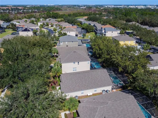 an aerial view of a house with a garden