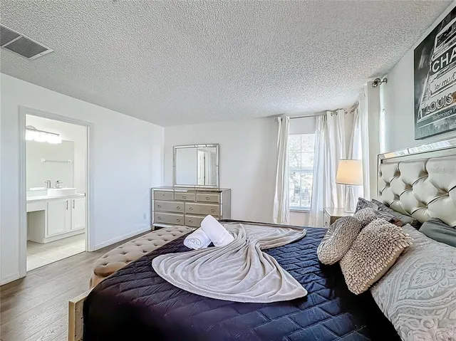 a bedroom with furniture and a window