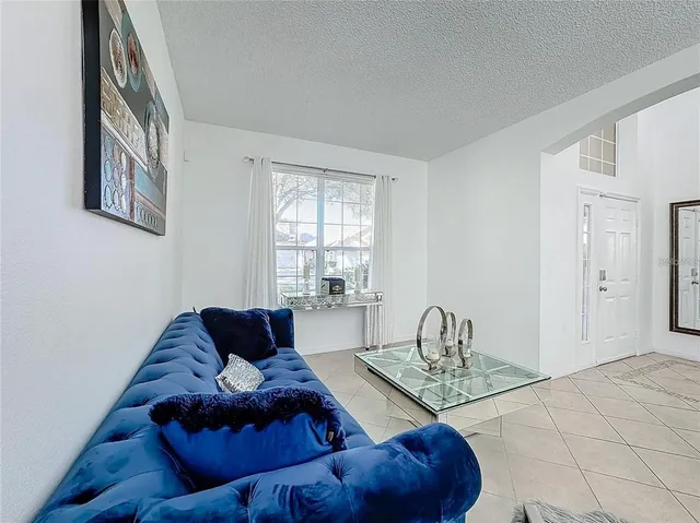 a living room with furniture and a window