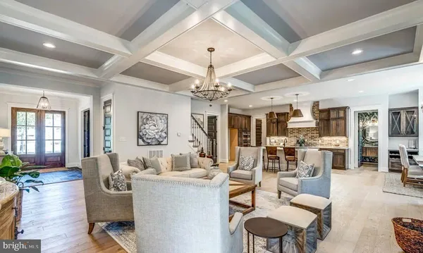 a view of living room filled with furniture and windows