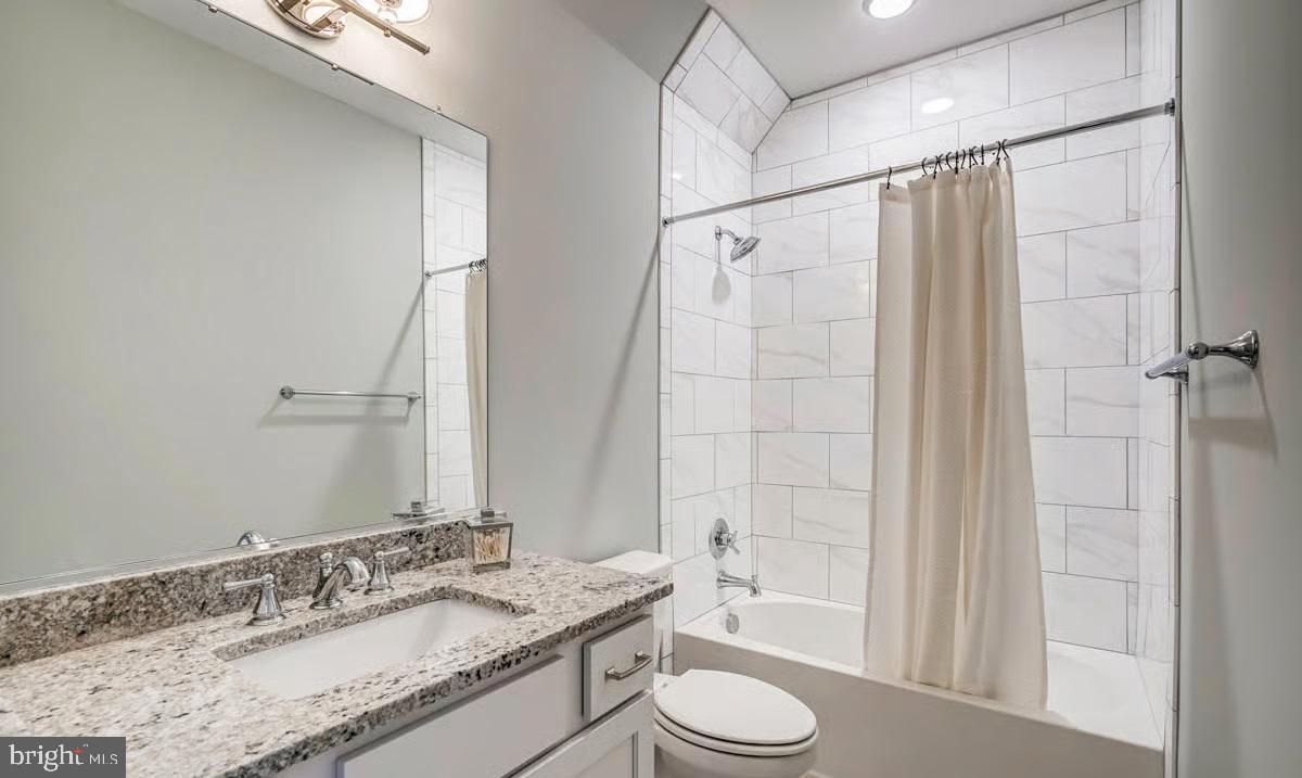 21049 Slab Bridge Road Freeland, MD 21053 - Photo 18 of 22 a bathroom with a granite countertop sink toilet and shower
