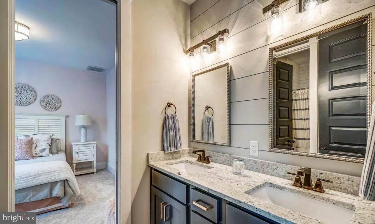 21049 Slab Bridge Road Freeland, MD 21053 - Photo 19 of 22 a bathroom with a granite countertop sink and a mirror