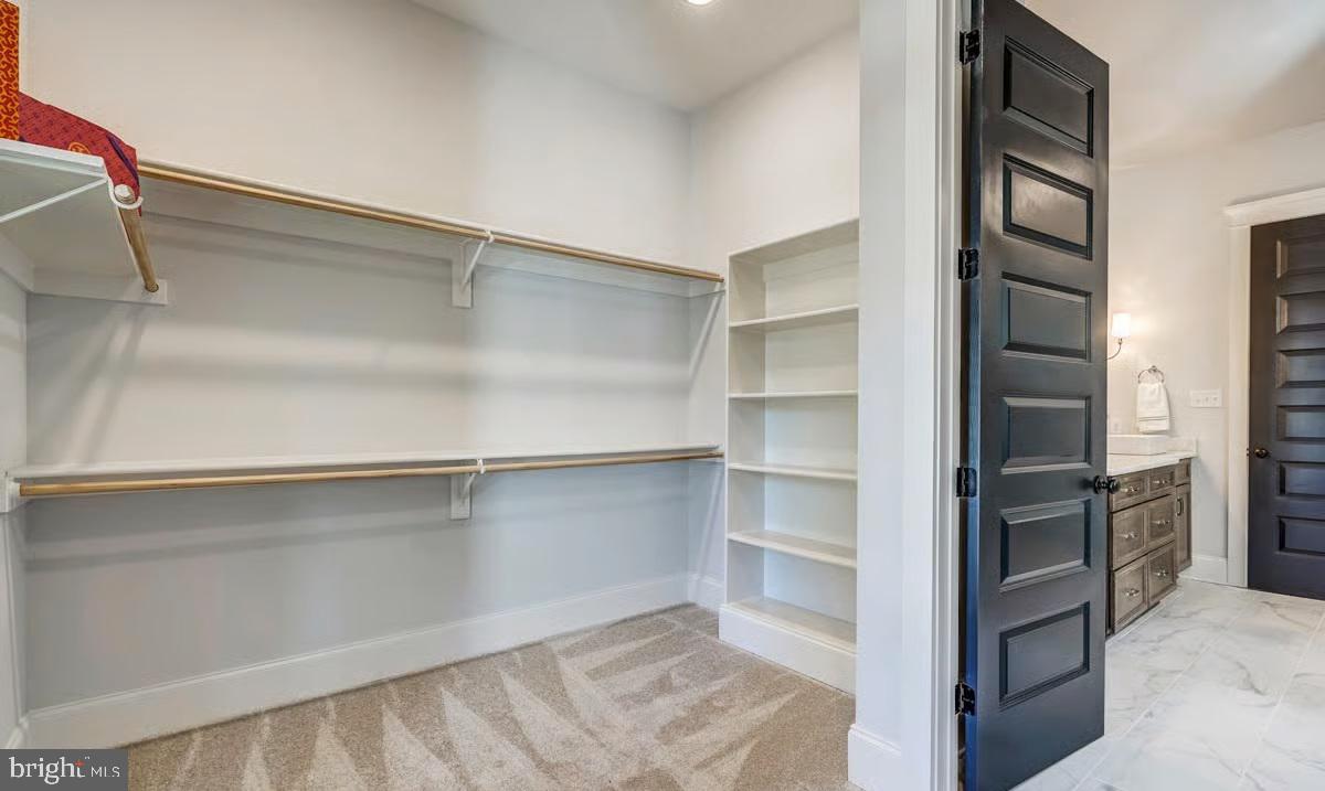 21049 Slab Bridge Road Freeland, MD 21053 - Photo 20 of 22 a view of walk in closet with empty racks