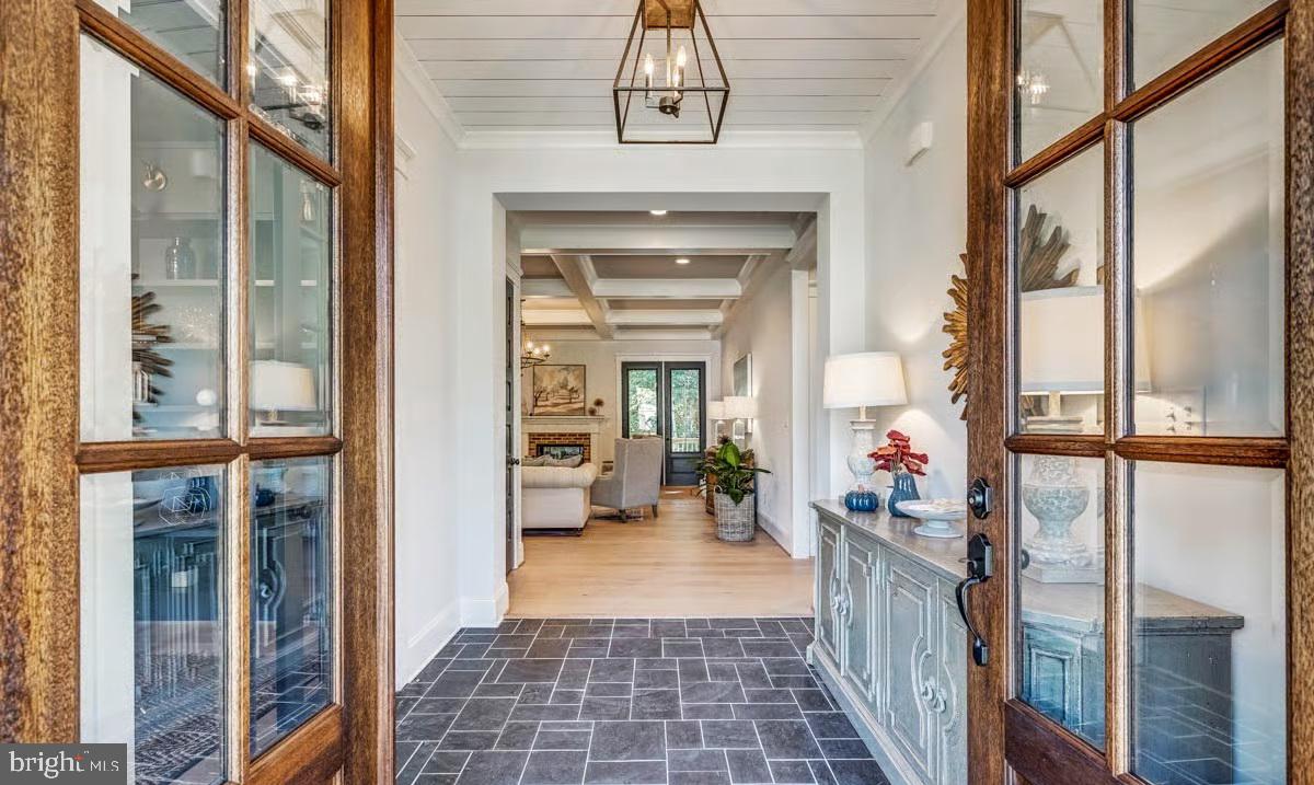 21049 Slab Bridge Road Freeland, MD 21053 - Photo 10 of 22 a view of a hallway with a dining table and chairs