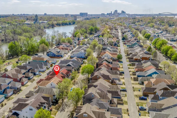 an aerial view of residential houses with outdoor space