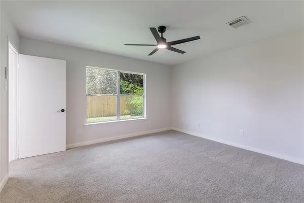a view of an empty room with a window