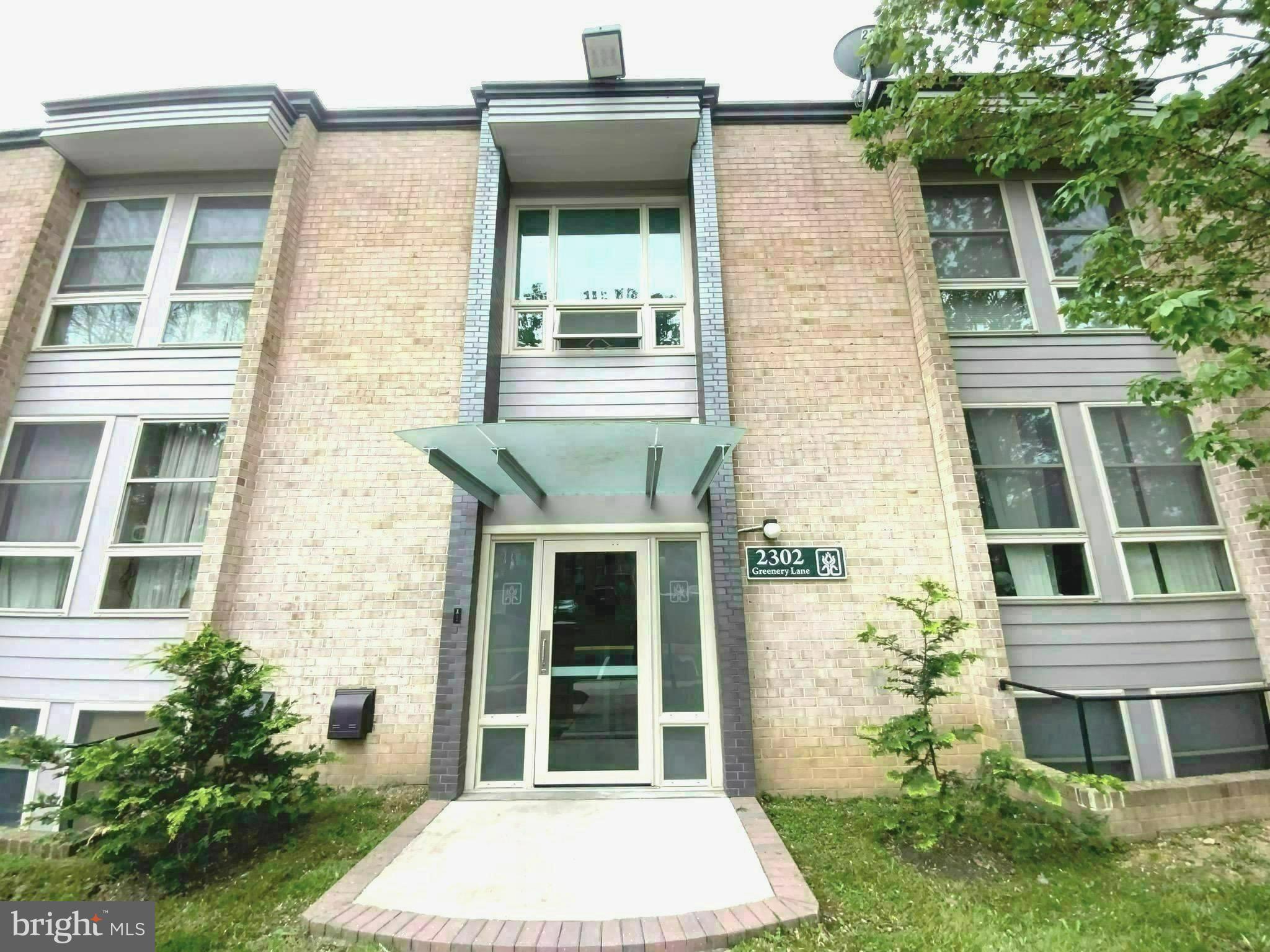 2302 Greenery Lane, Unit 30116 Silver Spring, MD 20906 - Photo 1 of 34 front view of a house with a yard