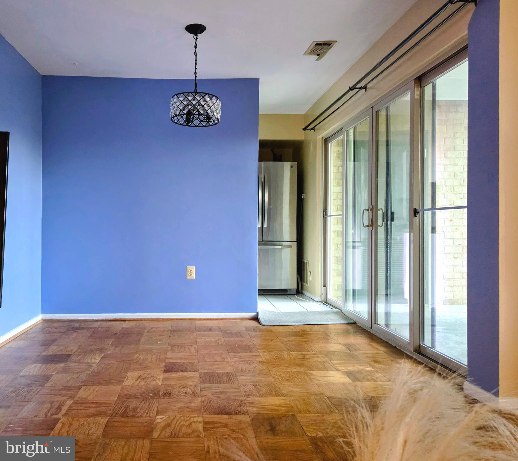 2302 Greenery Lane, Unit 30116 Silver Spring, MD 20906 - Photo 12 of 34 a view of an entryway with a chandelier