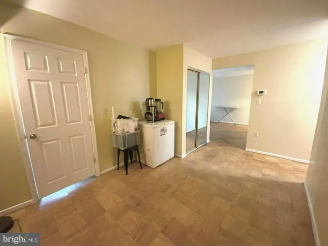 a view of a room with a furniture and closet
