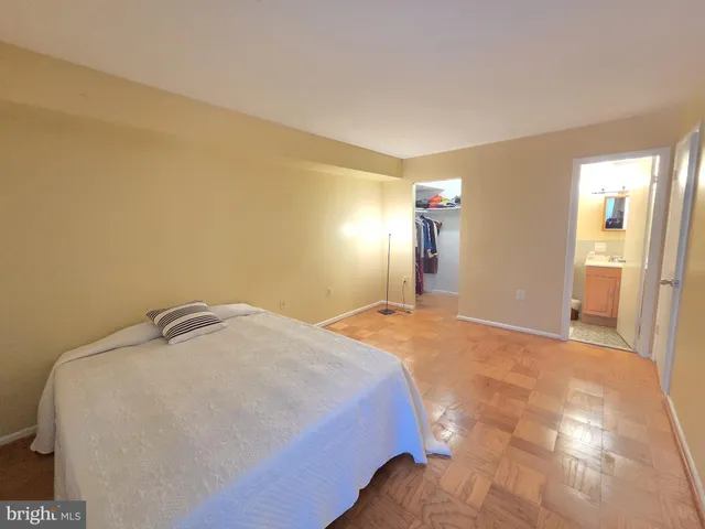 a bedroom with a bed and a cabinets