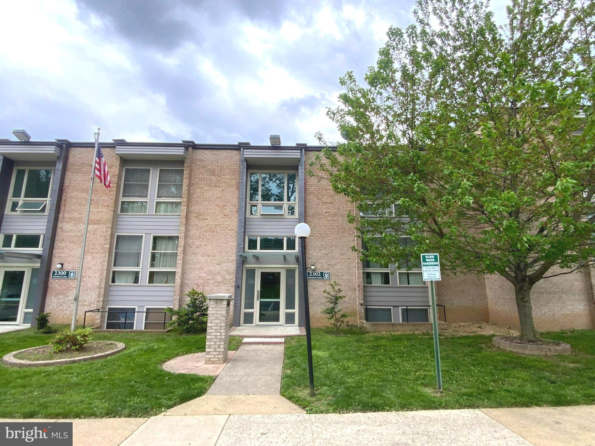 2302 Greenery Lane, Unit 30116 Silver Spring, MD 20906 - Photo 3 of 34 front view of a house with a garden