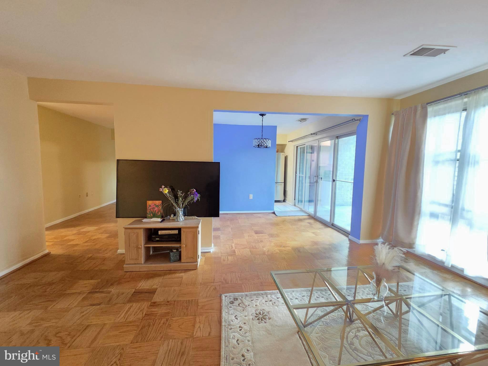 2302 Greenery Lane, Unit 30116 Silver Spring, MD 20906 - Photo 7 of 34 a living room with furniture and a window