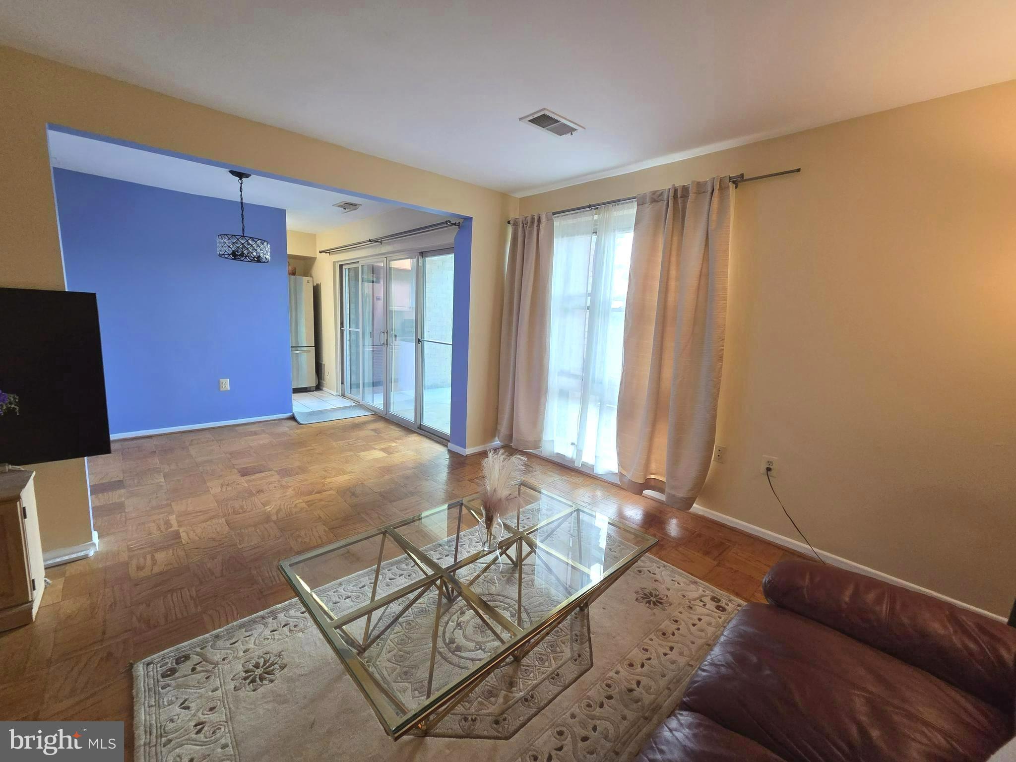 2302 Greenery Lane, Unit 30116 Silver Spring, MD 20906 - Photo 10 of 34 a living room with a couch