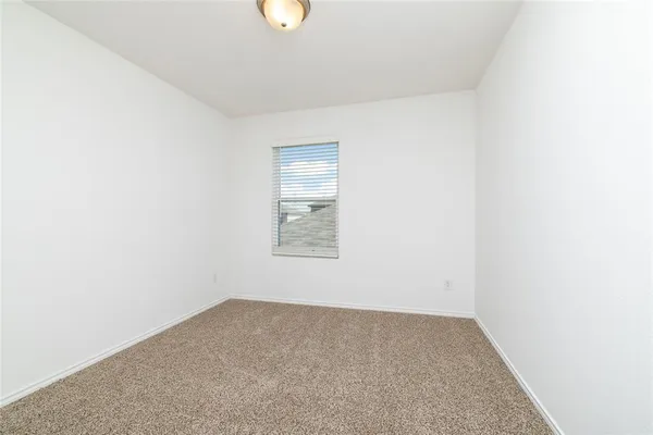 a view of a room that has a window in it