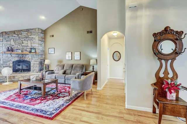 a kitchen with white cabinets and sink