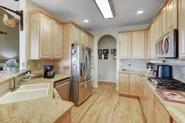 a bathroom with a double vanity sink toilet and shower