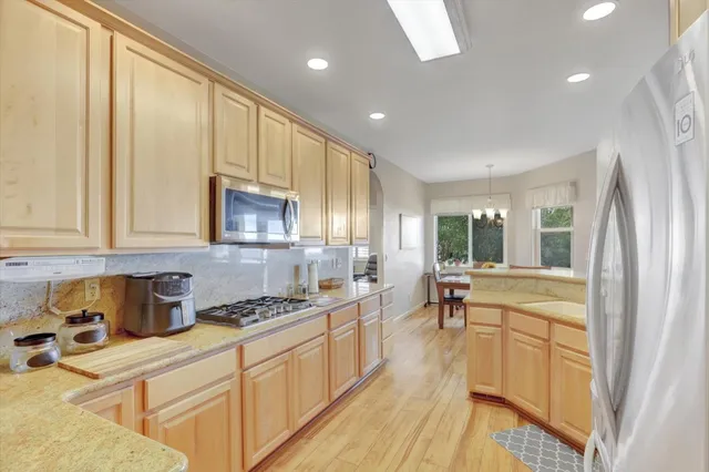 a view of a room with a table and chairs
