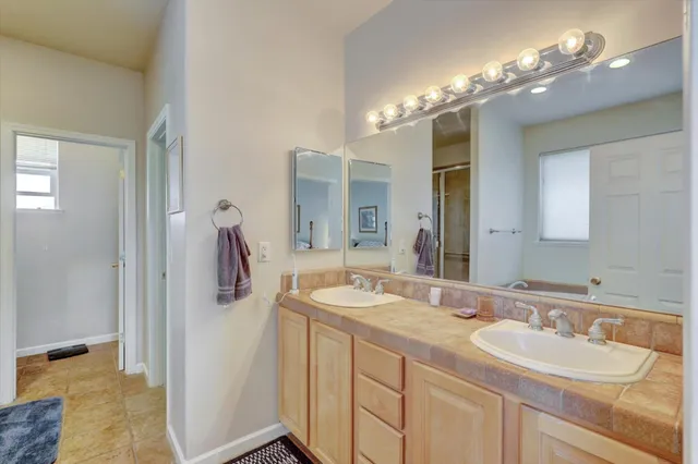 a room with furniture a flat screen tv and a window