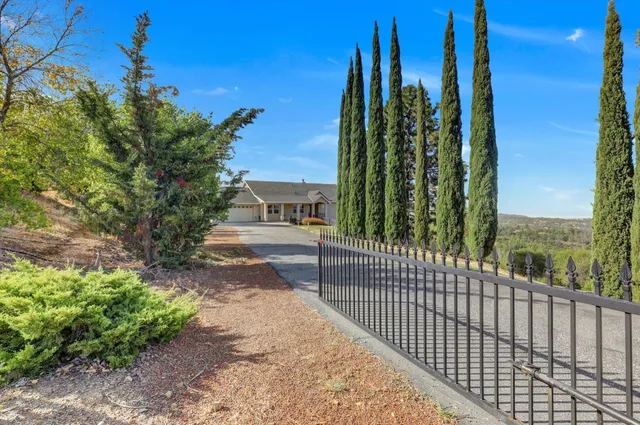a living room with furniture a rug and white walls