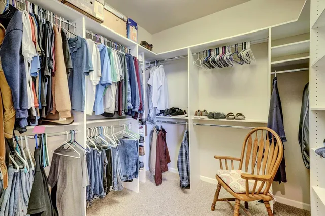 a view of a garden with a building in the background