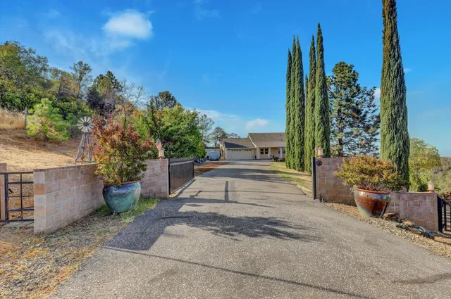 a view of a room with furniture and wooden floor