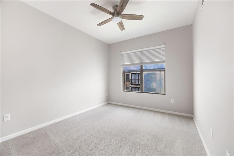 5300 Peachtree Road, Unit 3207 Chamblee, GA 30341 - Photo 14 of 25 an empty room with a ceiling fan and window