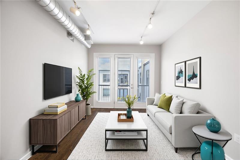 5300 Peachtree Road, Unit 3207 Chamblee, GA 30341 - Photo 10 of 25 a living room with furniture and a flat screen tv