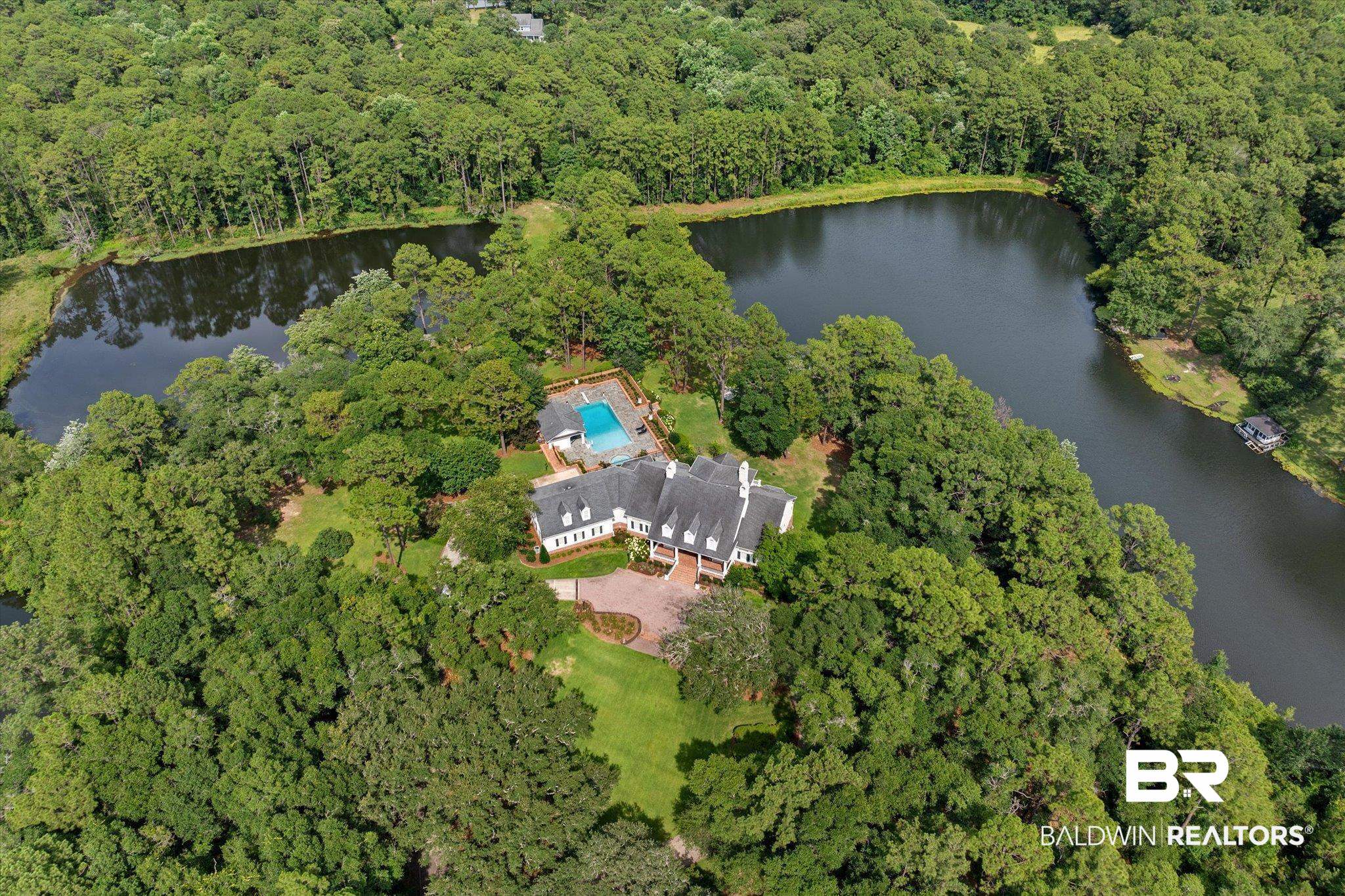 8561 Dawes Lake Road Mobile, AL 36619 - Photo 60 of 63 Aerial view of property and surrounding area with a large body of water