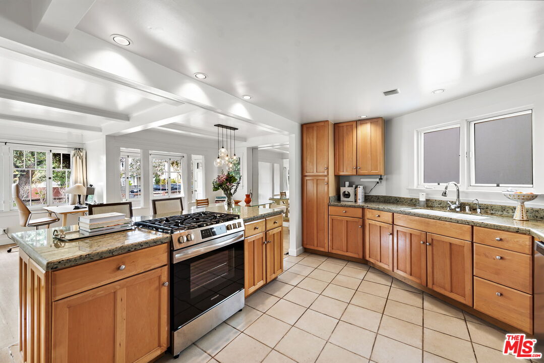 308 Windward Avenue Venice, CA 90291 - Photo 15 of 30 a kitchen with stainless steel appliances granite countertop a stove sink and cabinets
