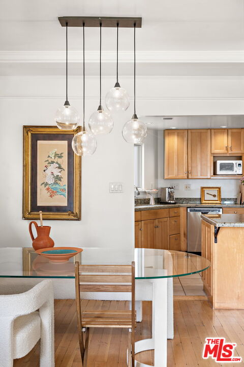 308 Windward Avenue Venice, CA 90291 - Photo 6 of 30 a kitchen with stainless steel appliances granite countertop a sink and a refrigerator