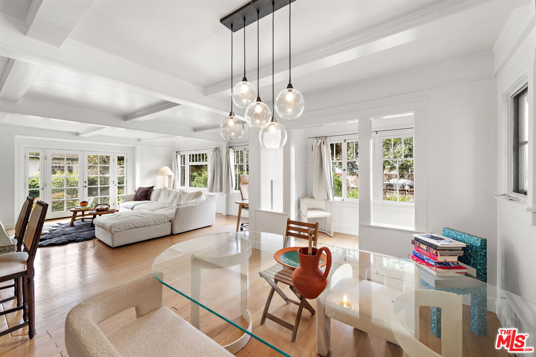 308 Windward Avenue Venice, CA 90291 - Photo 7 of 30 a living room with furniture and a chandelier