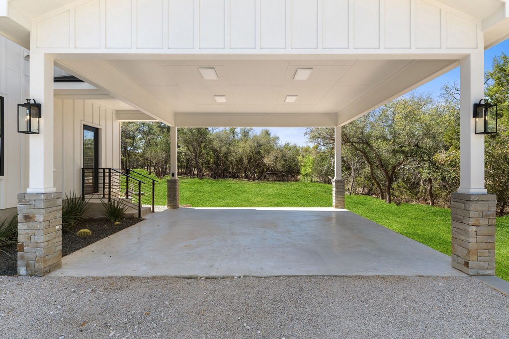 408 Rust Ranch Road Blanco, TX 78606 - Photo 27 of 35 Porch featuring a lawn
