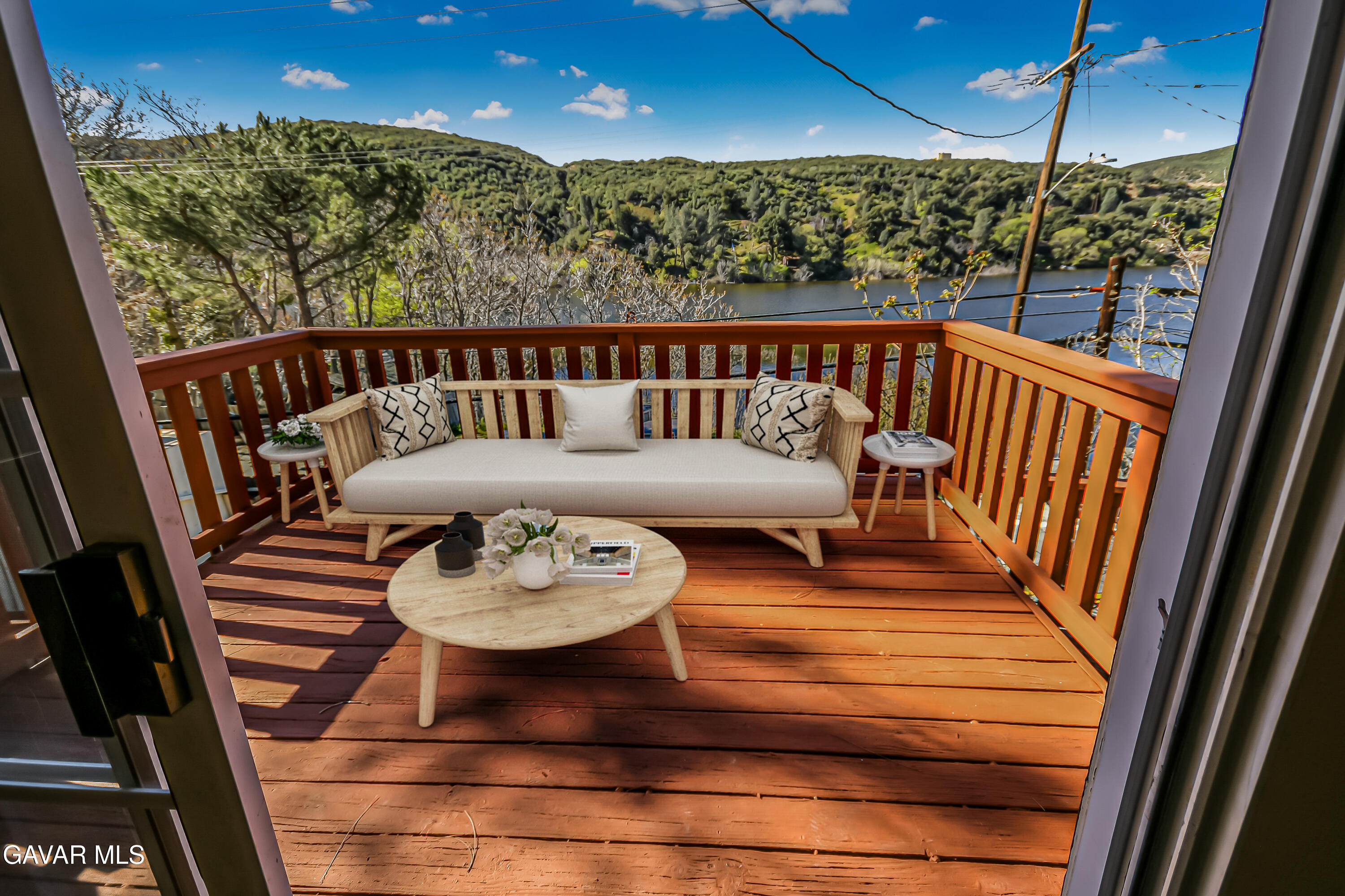 a view of a balcony with furniture