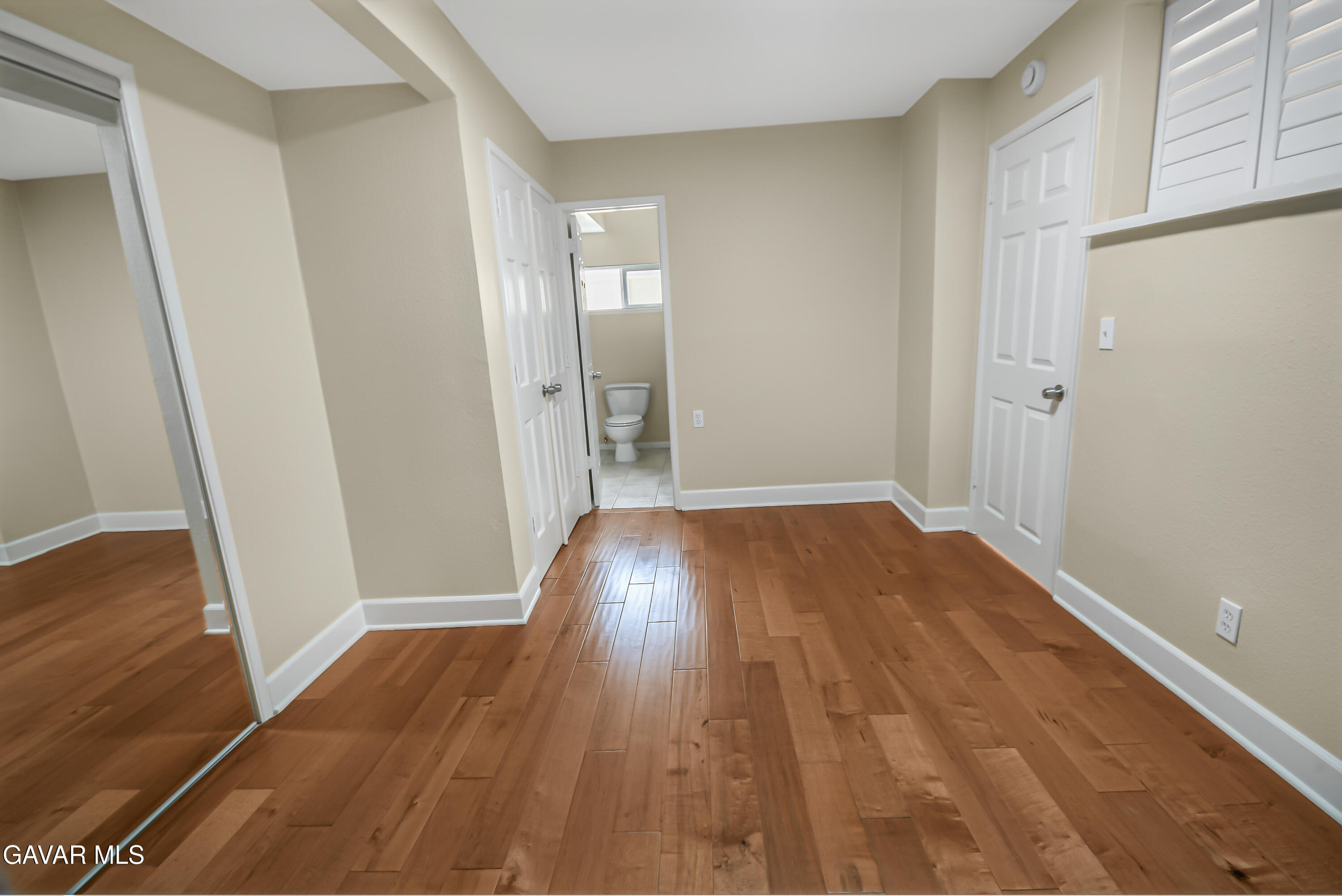 17743 Elizabeth Lake Road Lake Hughes, CA 93532 - Photo 14 of 33 a view of a room with wooden floor and cabinet