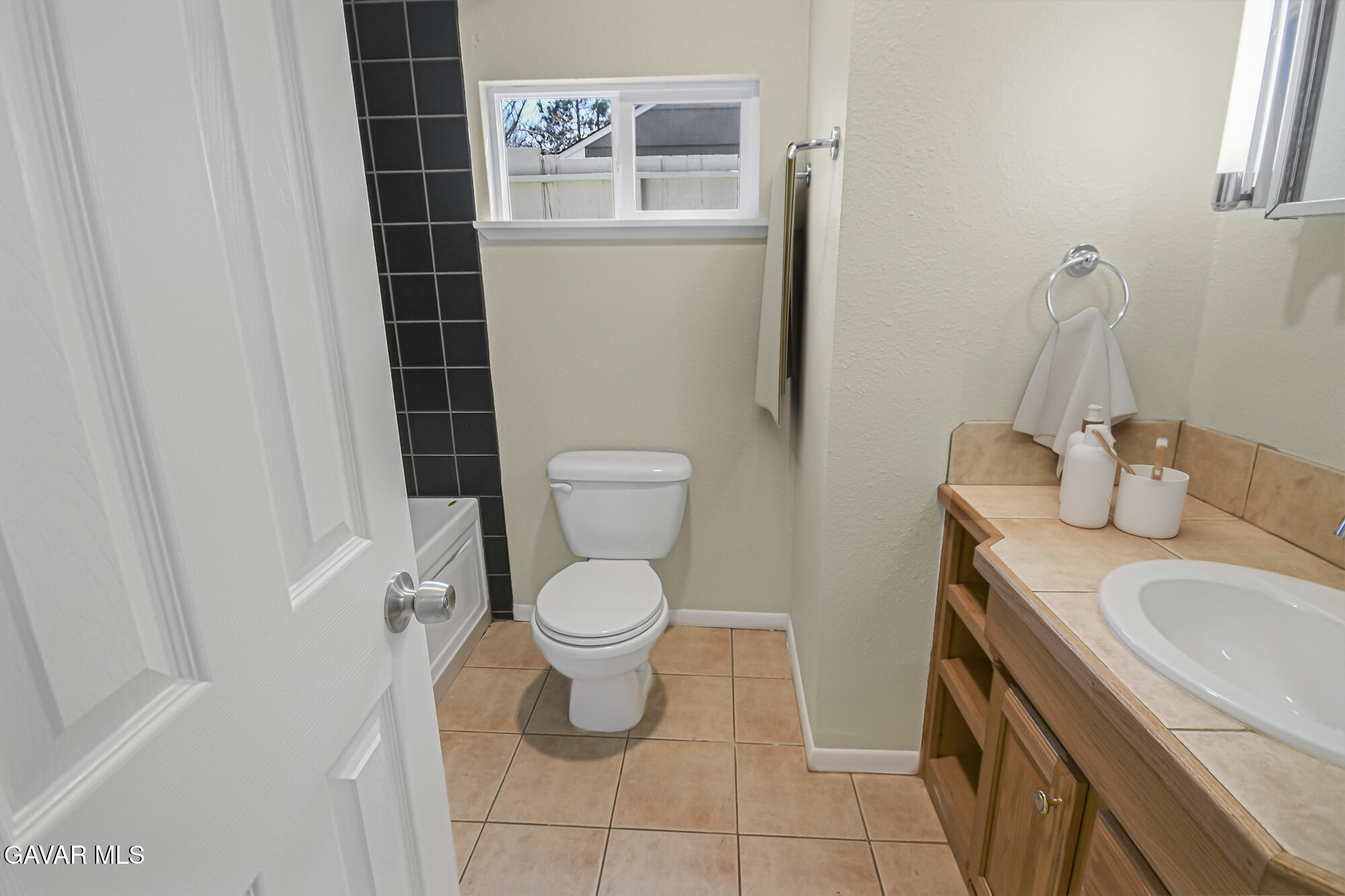 17743 Elizabeth Lake Road Lake Hughes, CA 93532 - Photo 15 of 33 a white toilet sitting next to a bathroom sink