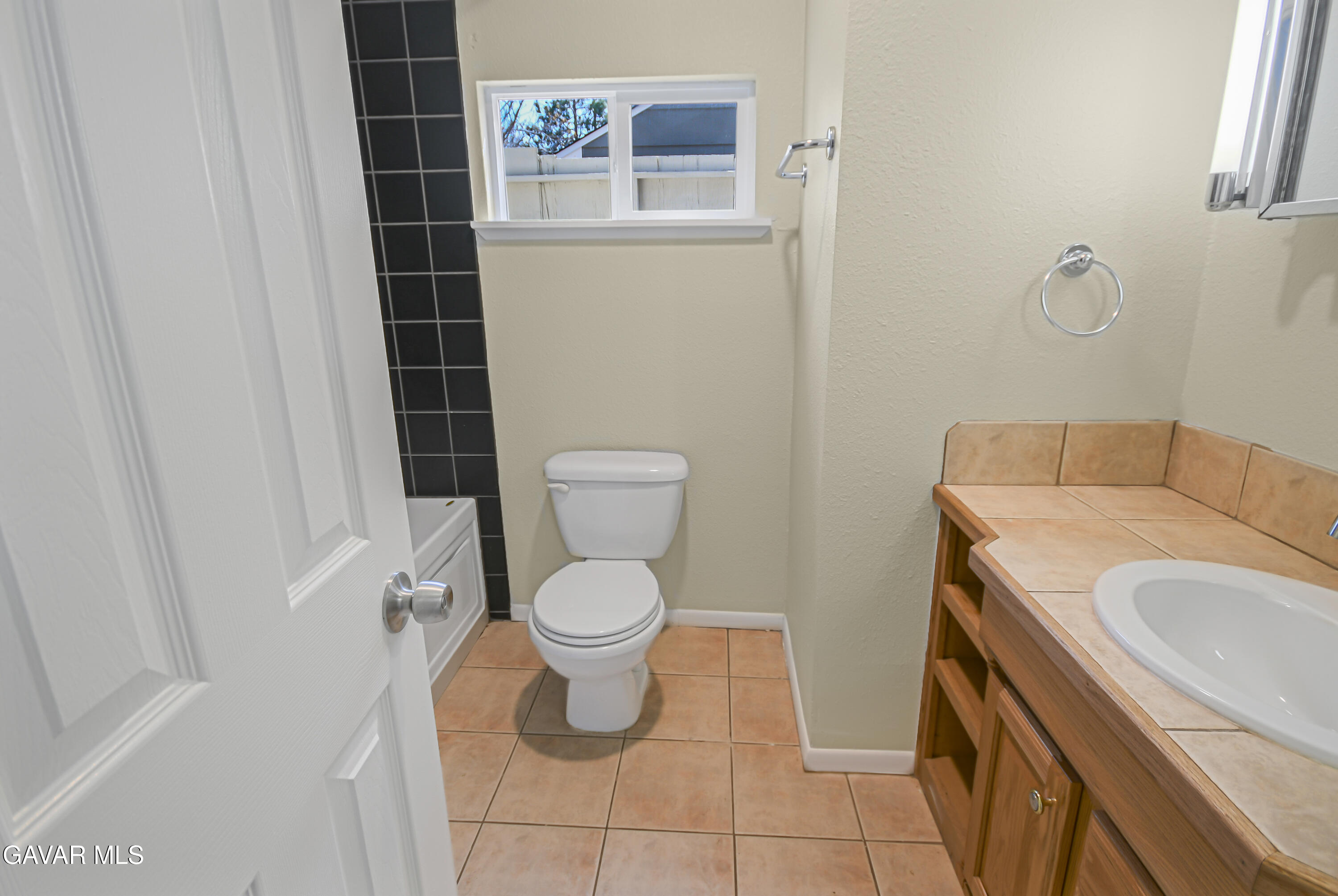 17743 Elizabeth Lake Road Lake Hughes, CA 93532 - Photo 16 of 33 a bathroom with a sink a toilet and a tub