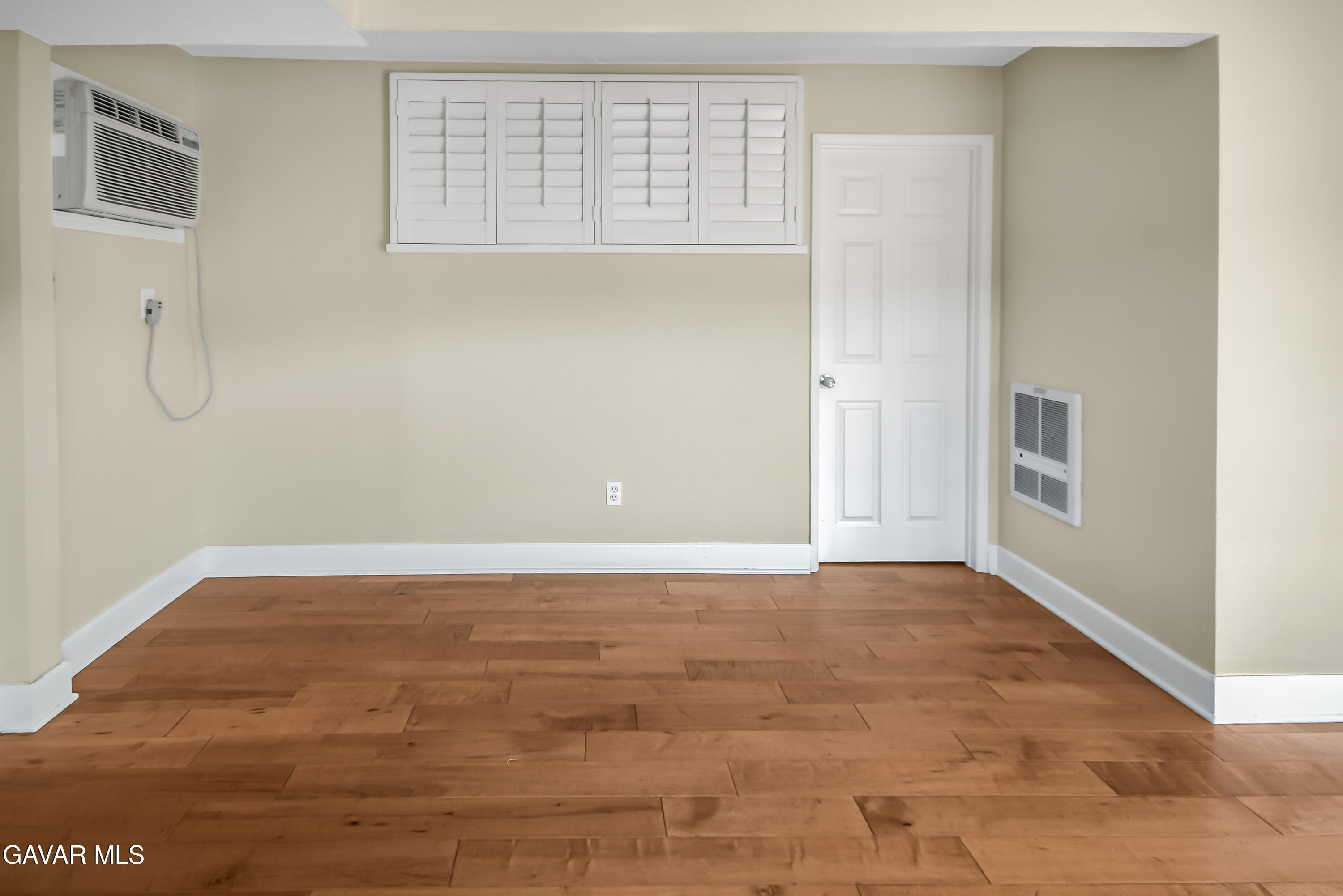 17743 Elizabeth Lake Road Lake Hughes, CA 93532 - Photo 8 of 33 a view of an empty room with wooden floor and a window